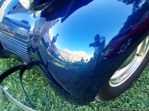 Reflection in a polished classic car